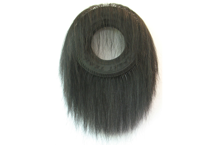 <b>Untitled (Large Tire)</b><br>31” x 24” x 6”<br>rubber tire, horse hair, embroidery needles